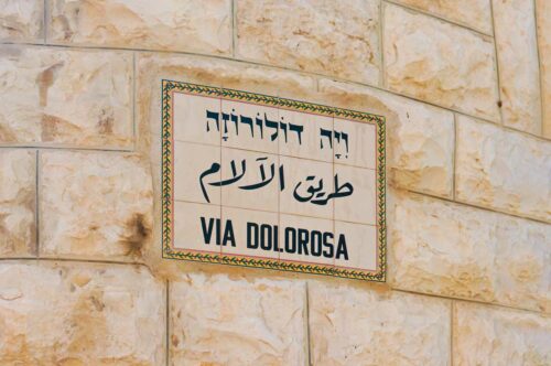 Via Dolorosa street sign in English, Arabic, and Hebrew in the Old City of Jerusalem